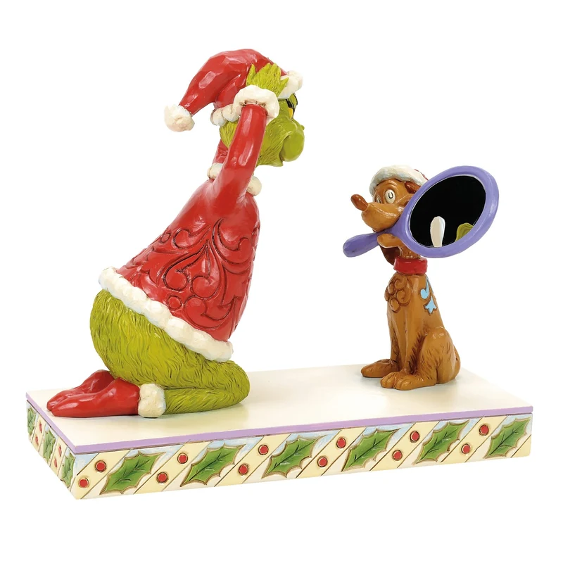 Max hält einen Spiegel für die Grinch-Figur, Jim Shore 2025